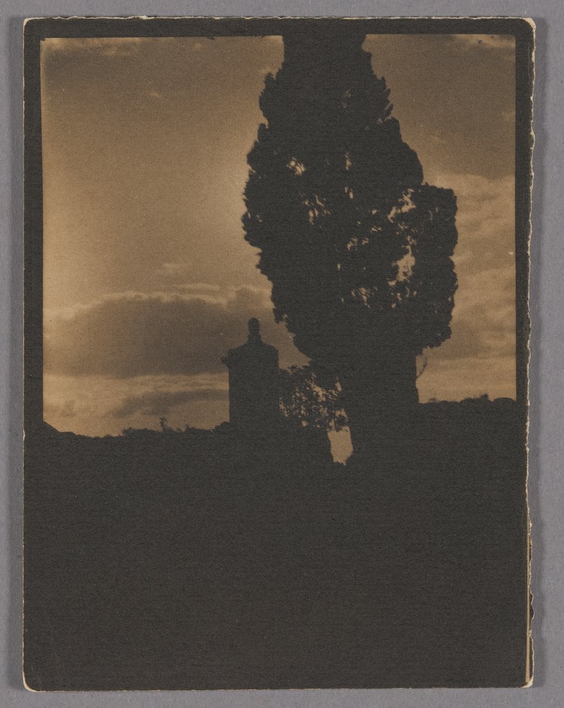 Silhouette of tree and tower in the evening sky, Adolphe de Meyer